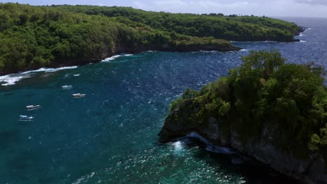 Aerial-Scenic-View-Of-Outrigger-Jukung-Boats-Around-Crystal-Bay-Nusa-Penida,-Bali-Indonesia