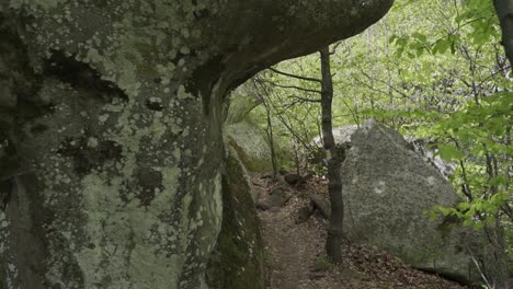 Drone-flying-through-the-boulders-and-forest-of-Belintash-in-Asenovgrad,-in-Plovdiv-Province,-Bulgaria
