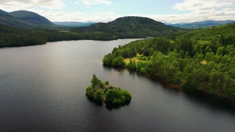 Scottish-Highlands-Revealed:-Aerial-Views-of-the-Enigmatic-Loch-An-Eilein-Castle-and-Scots-Pine-Forest,-Aviemore,-Cairngorms,-UK