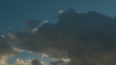 Timelapse-of-Moving-Clouds-Against-a-Blue-Sunny-Sky,-Low-Angle-Static