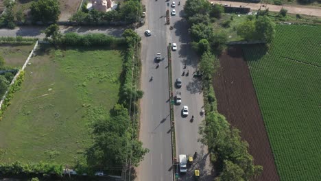 Rajkot-city-aerial-view-flying-between-drones,-many-four-wheels-are-also-visible