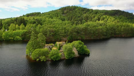 United-Kingdom's-Highland-Realm:-Aerial-Perspective-of-Loch-An-Eilein-with-Its-Castle-and-Scots-Pine-Forest,-Aviemore,-Scotland,-Cairngorms