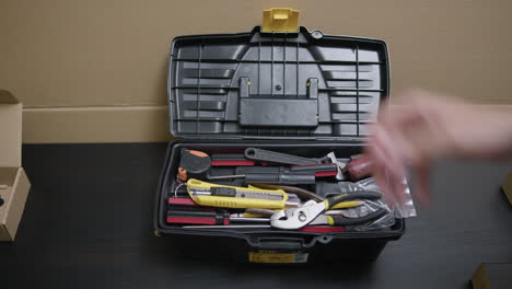 man-open-a-toolbox-for-work