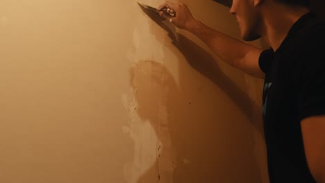 Worker-Skimming-Wall-with-Putty-Knife-for-Smooth-Finish