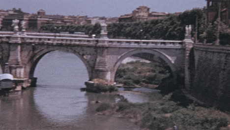 Cars-Drive-on-Bridge-of-Angels-Over-the-River-Tiber-in-Rome-in-the-1960s