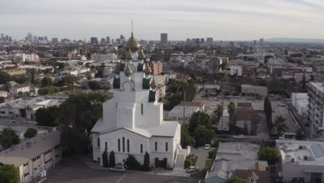 4K-aerial-arc-around-the-Holy-Transfiguration-Russian-Orthodox-Church-in-Hollywood-California-with-the-Downtown-Los-Angeles-Skyline-in-the-background