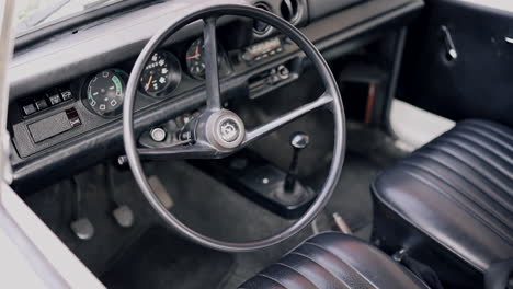 Vintage-Car-Interior-with-Classic-Steering-Wheel