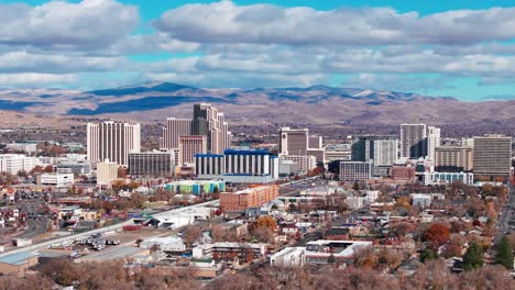 Drone-view-panning-to-the-right-of-many-casinos-in-downtown-Reno,-Nevada