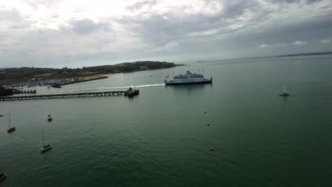 Aerial-Drone-footage-of-a-ferry-leaving-a-port-on-the-Isle-of-Wight