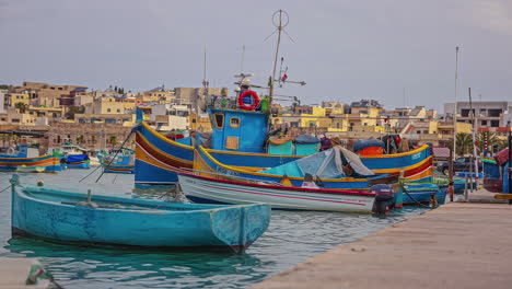 Timelapse-of-a-small-port-with-colorful-boats-anchored-in-Marsaxlokk
