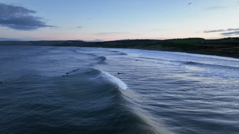 Surf's-Up-in-Scotland:-Aerial-View-of-Waves-off-Thorntonloch-Beach-at-Sunset,-North-Sea-Coast,-Dunbar,-Scottish-Coast-Near-Edinburgh,-Scotland,-United-Kingdom