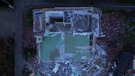 Birdseye-view-of-extensive-damage-and-rubble-remains-of-rundown-property