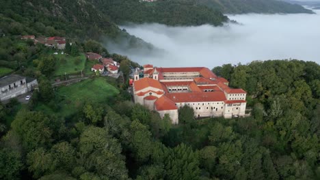 Drone-Footage-Santo-Estevo-Monastery-And-Foggy-Sil-Canyon,-Luintra,-Spain