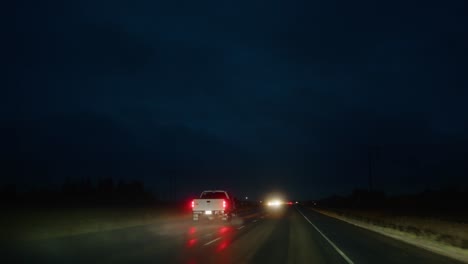 Night-drive-with-glowing-car-tail-lights
