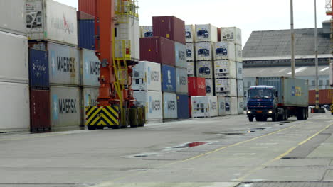 general-shot-of-forklift-loading-a-container,-customs
