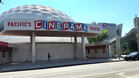 Driving-by-Pacific's-Cinerama-Theatre-in-Hollywood,-California-POV