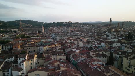 Aerial-overview-of-Florence-Italy-cityscape,-historic-building-towers-and-chapel-spires