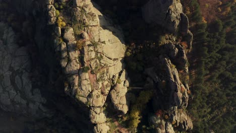 Overhead-drone-shot-of-the-natural-rock-formations-of-Belogradchik-Fortress-which-used-to-be-an-ancient-Roman-stronghold-on-the-slopes-of-the-Balkan-Mountains-in-Vidin-province,-Bulgaria