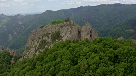 Circling-around-Belintash,-a-rock-in-the-shape-of-a-small-plateau-believed-to-be-a-cult-site-used-for-ritual-purposes-by-tribes-in-the-area-of-Rhodope-mountains
