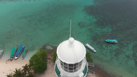 Famous-white-lighthouse-at-Lengkuas-Island-Belitung,-aerial
