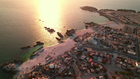 Aerial-Panoramic-view-of-Bahía-Inglesa-resort-and-beach-during-golden-hour