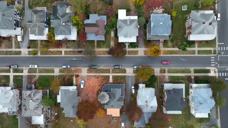 Bird's-eye-view-of-a-residential-street-with-houses-and-autumn-trees