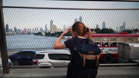 Female-Backpacker-Enjoying-The-City-Views-From-The-Chao-Phraya-Sky-Park-In-Bangkok-Thailand