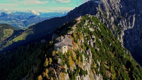 Aerial-panoramic-view-of-Historic-mountaintop-retreat-The-Eagle's-Nest-Kehlsteinhaus-amid-autumn-forest,-Germany
