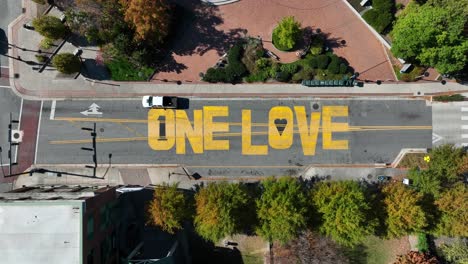 Downtown-street-in-Greensboro,-North-Carolina,-featuring-the-"One-Love"-street-mural