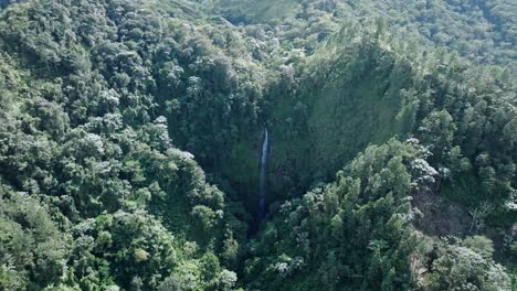 Waterfall-falling-into-the-jungle-in-the-Salto-del-Rodeo-region-of-Bonao_aerial-shot