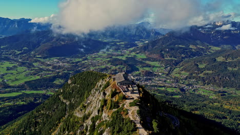 Historic-Eagles-Nest-on-ridge-line-of-Kehlsteinhaus-Germany,-aerial-overview