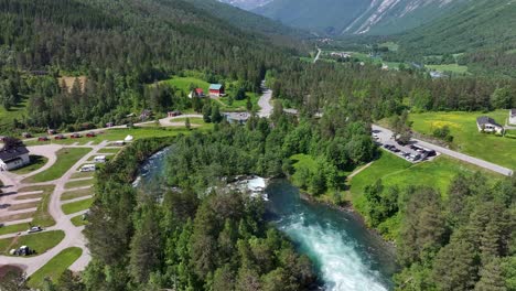 The-drone-gliding-over-the-river-Valldøla-in-Valldal,-Norway