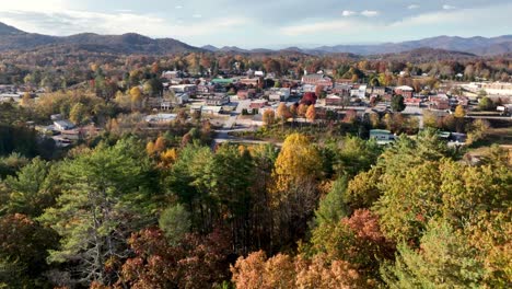 aerial-high-above-franklin-nc-over-the-treetops-in-fall