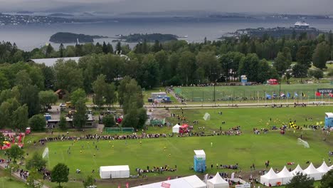 Drone-glides-sideways-along-the-soccer-pitches-at-Ekebergsletta-during-the-Norway-Cup-2023,-just-outside-the-center-of-Oslo