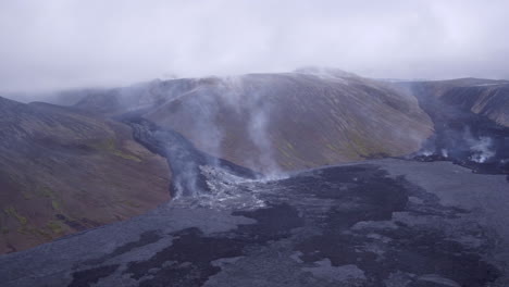 Fagradalsfjall-volcano-in-Iceland-aerial-shot-tracking-above-cooling-lava-fields