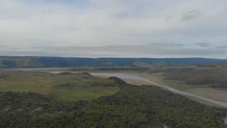Aerial-shot-moving-over-a-river-along-the-great-ocean-road-on-Victorias-cape-otway-coastline