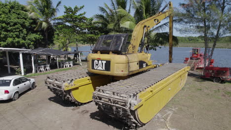 Panning-a-Caterpillar-backhoe-excavator,-showcasing-the-precision-and-power-of-construction-machinery