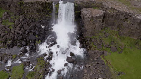 Öxarárfoss-waterfall-in-Iceland-aerial-pull-back-shot-from-birds-eye-view