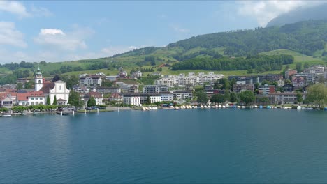 Kussnacht-Flyover:-Moving-Over-Scenic-Water-Valley-and-Village-in-Alps-Mountains,-Switzerland,-Europe,-Drone-|-Dramatic-Cinematic-Approaching-Shot-of-Small-City-on-Vast-Lake-and-Countryside