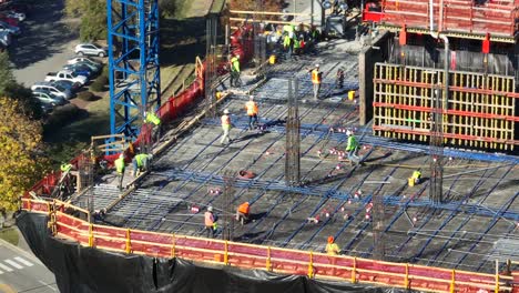 Workers-on-a-construction-site-with-rebar-and-concrete-formwork