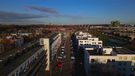 Crane-up-from-residential-apartment-blocks-to-Amsterdam-Noord-Vogelbuurt-district-panorama