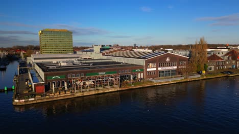 Trendy-restaurant-Lowlands-and-Kromhouthal-next-to-IJ-river-in-Amsterdam-Noord