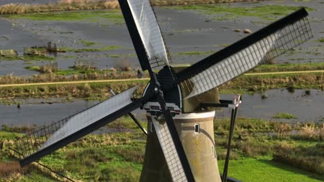 Telephoto-orbiting-aerial-footage-around-historic-windmill-Boezemmolen-Nr