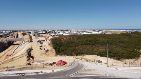 Pan-right-Clip-Of-Yanchep-Rail-Extension-Works-At-Romeo-Road-Alkimos,-Perth