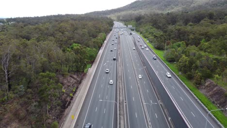 Aerial-view-of-a-multi-lane-freeway-with-traffic-flowing-freely