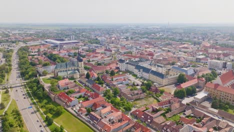 Trnava-city-with-Saint-Nicolas-Church,-Slovakia,-Europe---Sunny-Aerial-Clip