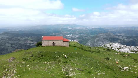 Monsacro-and-its-chapels,-Asturian-sacred-mountain,-located-in-the-heart-of-the-Asturian-Central-Mountain,-Aramo-mountain,-aerial-view