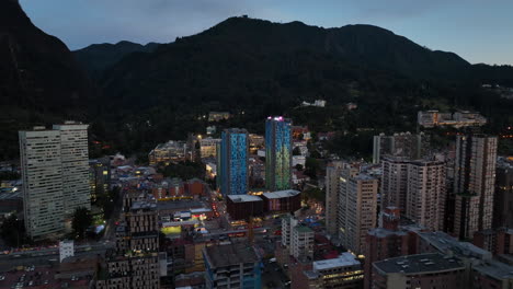 Aerial-view-toward-colorful-condos-at-a-University-in-Bogota,-dusk-in-Colombia