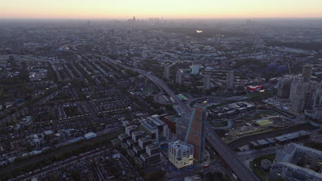 Wide-aerial-shot-of-Shepherds-bush-and-London-skyline-at-dawn