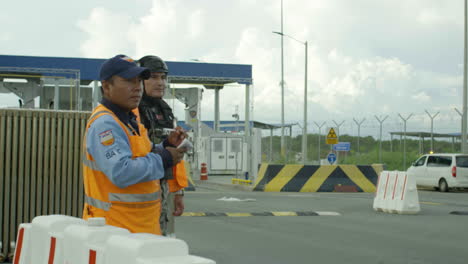 shot-of-male-police-officer-checking-documents,-customs
